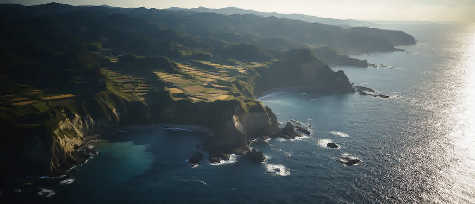 Aerial view of Sado’s rocky coast in late light